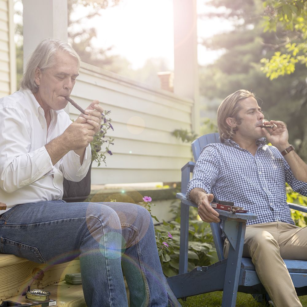 A photo of father and son enjoy a smoke together, featured in trade ads.